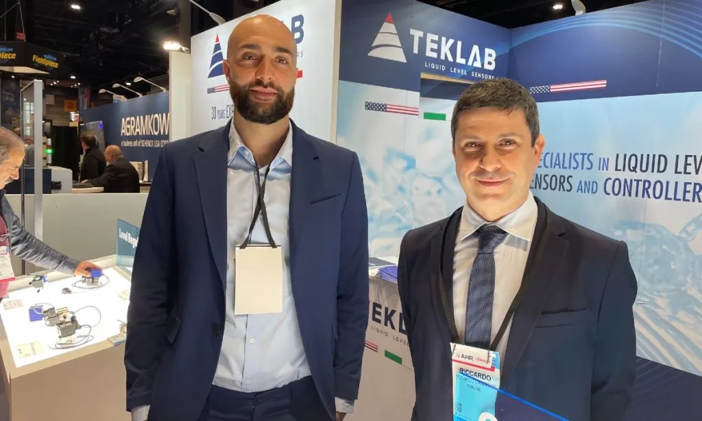 From left: Daniele Barbieri and Riccardo Candrini of Teklab, at their booth at AHR Expo 2024 in Chicago, January 22–24.