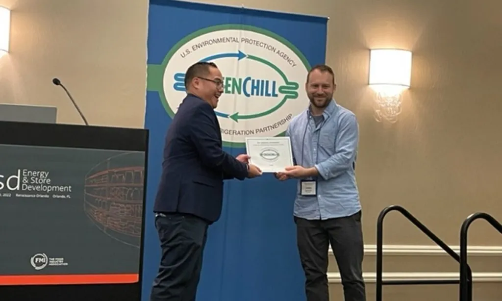 From left: Kersey Manliclic of the EPA and Chris Smyser of ALDI US, accepting the Store Certification Excellence (Supermarket) GreenChill award.