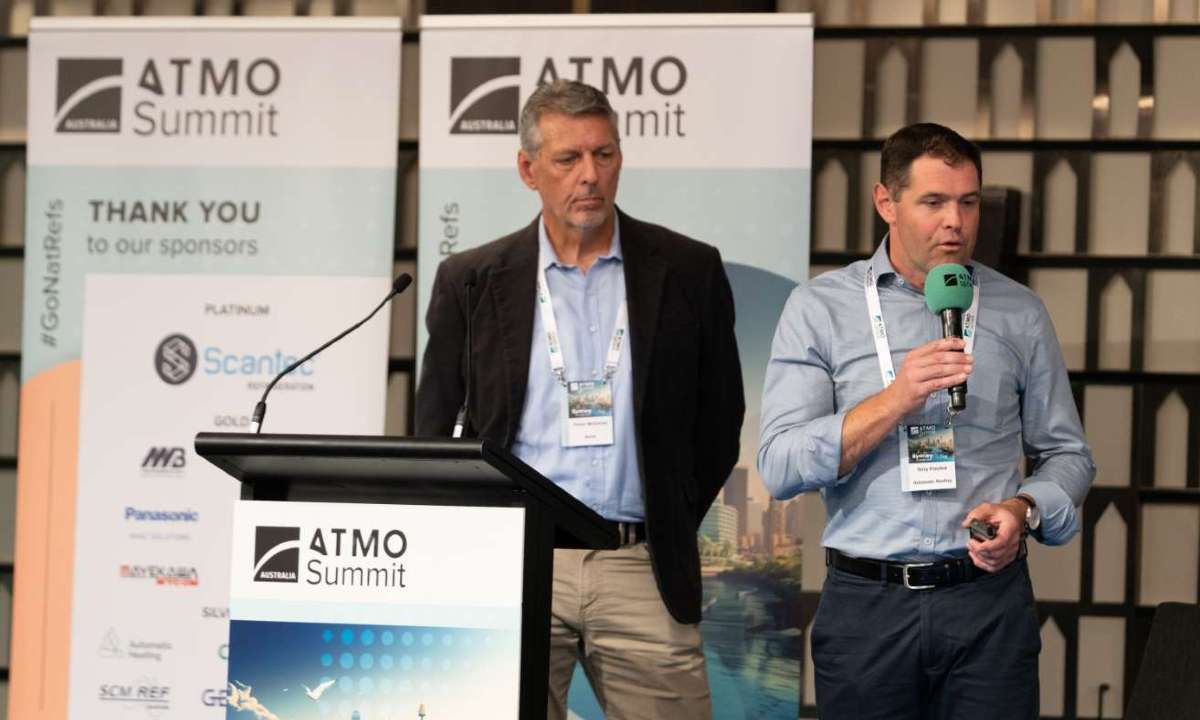 Trevor McCarren (L), Director of Technical Services – Pacific North at Accor Hotels, and Terry Plaisted, Director of Automatic Heating, presenting about a recent CO2 heat pump installation at the ATMO Australia Summit 2025.