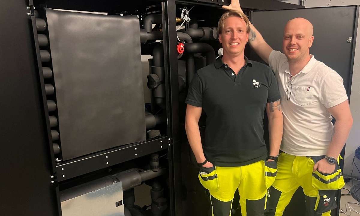 Marius Sandem and Eskil Westegaard, Tequs, with the company’s CO2 heat pump at the AdO Arena. Photo credit: Tequs