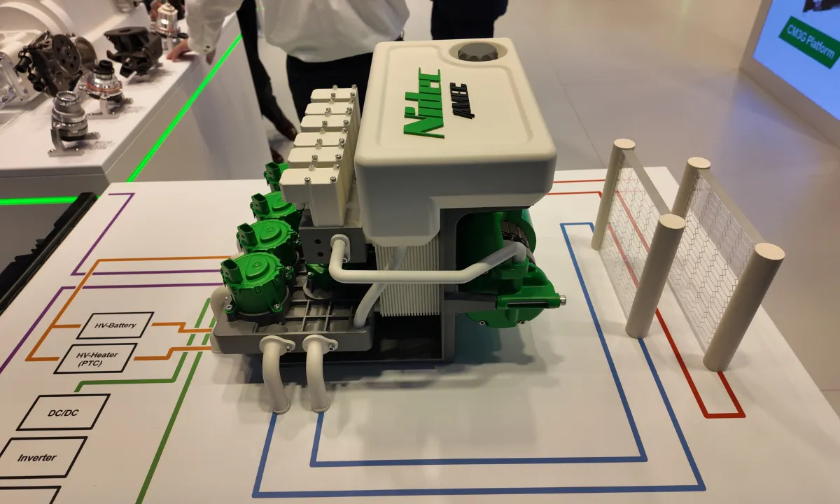 A model of Nidec Global Appliance's R290-based thermal management module. The green represents components supplied by Nidec.