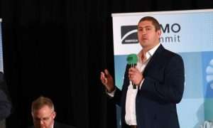 An image of Brannon Wynn, Project Executive at MAI Construction, presenting at ATMO America 2026.